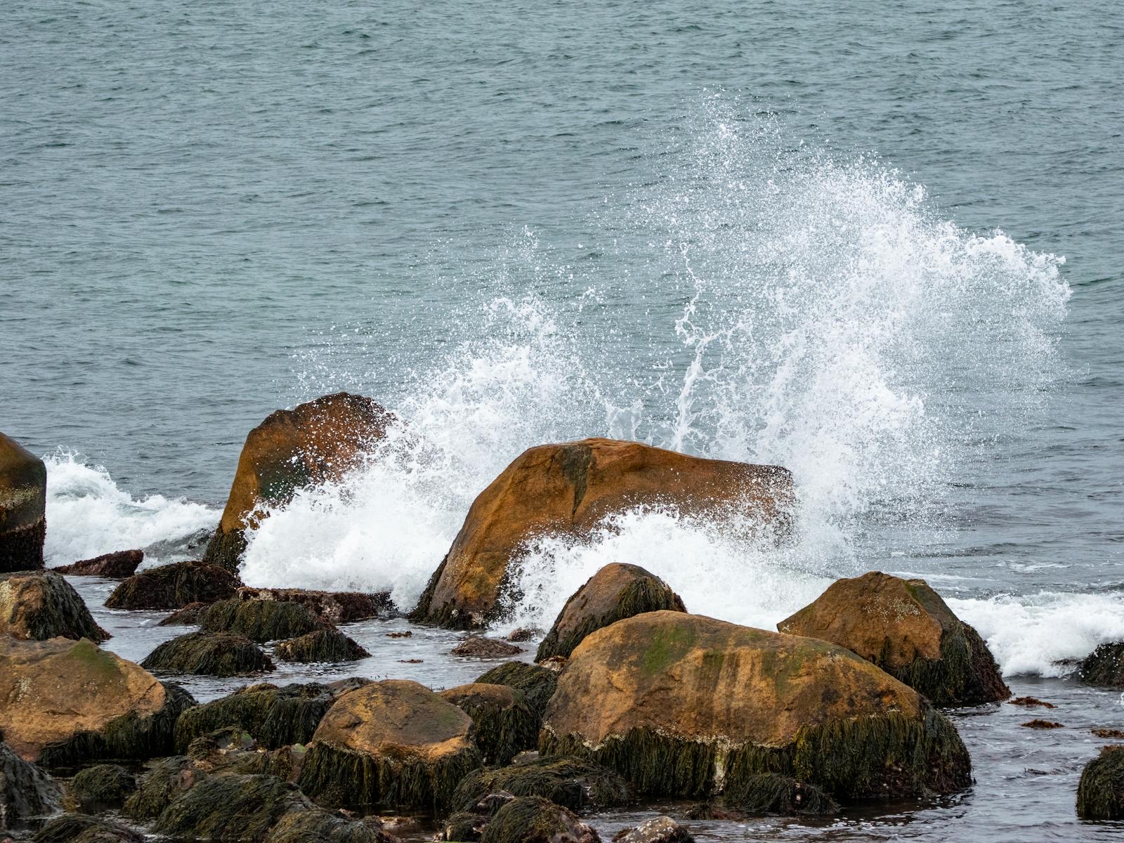 Waves crashing over rocky shoreline in New Shoreham on Block Island