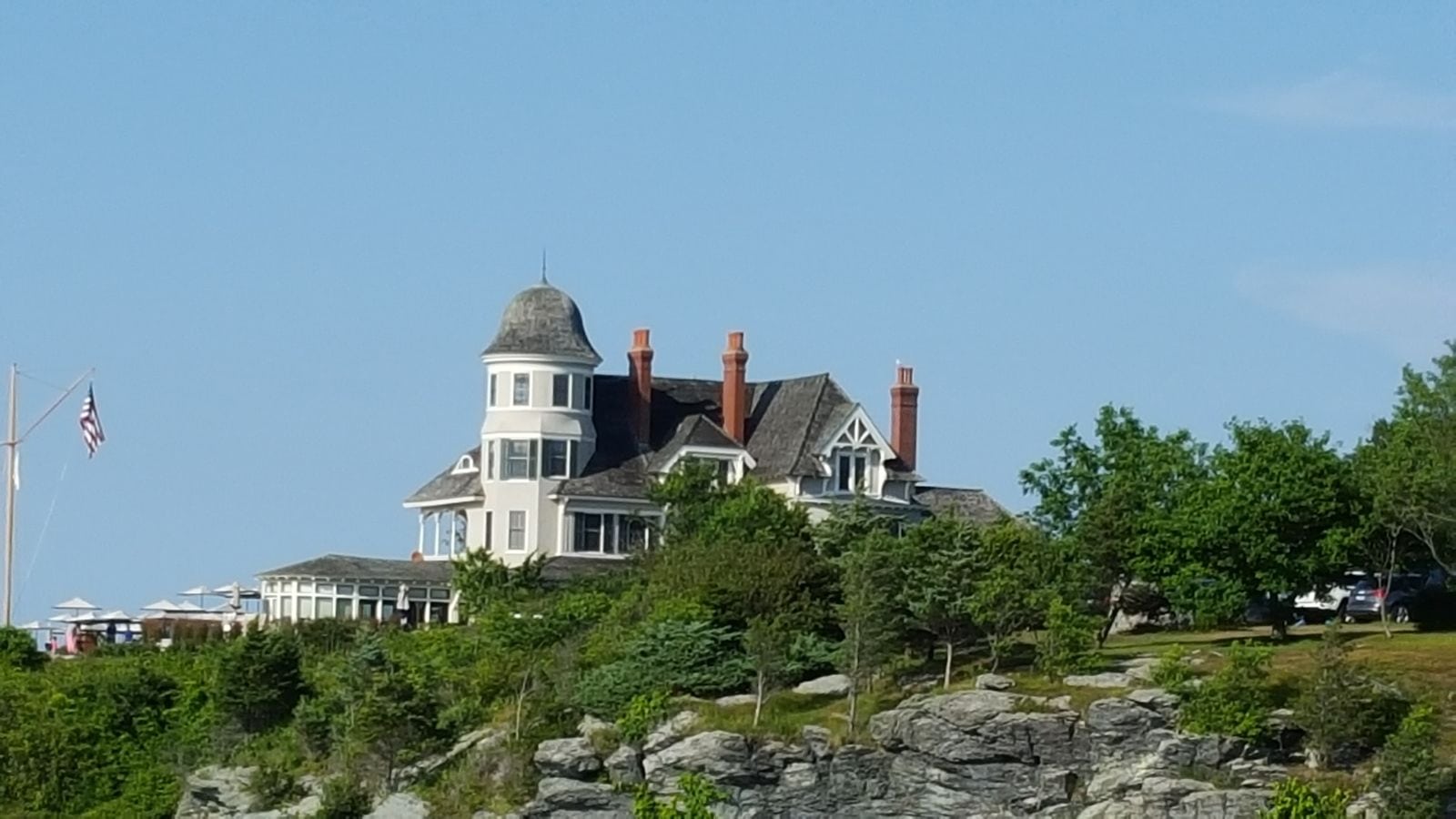 Castle Hill Inn's turreted main house above the rocky Newport shoreline